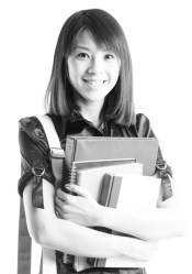 An isolated shot of a beautiful asian college student carrying books